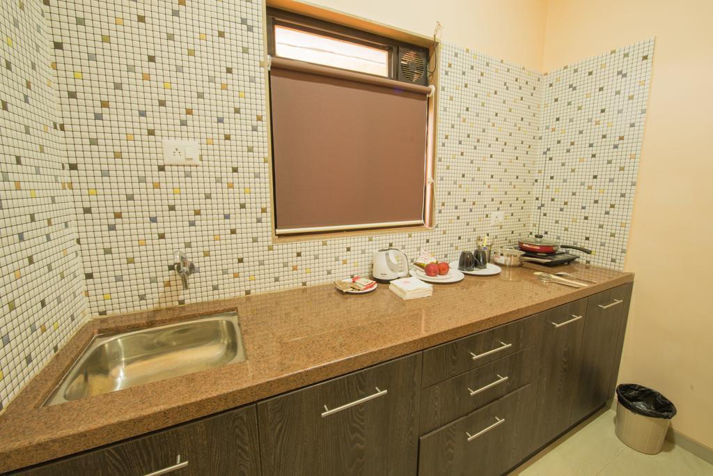 Budget Inn Service Apartments - Tiger Plaza Vengni Room photo